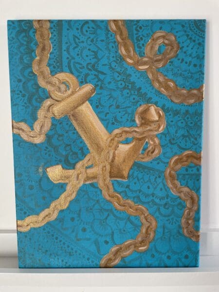 golden anchor on blue background