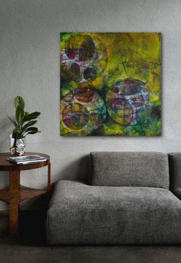 Painting hung above a sofa