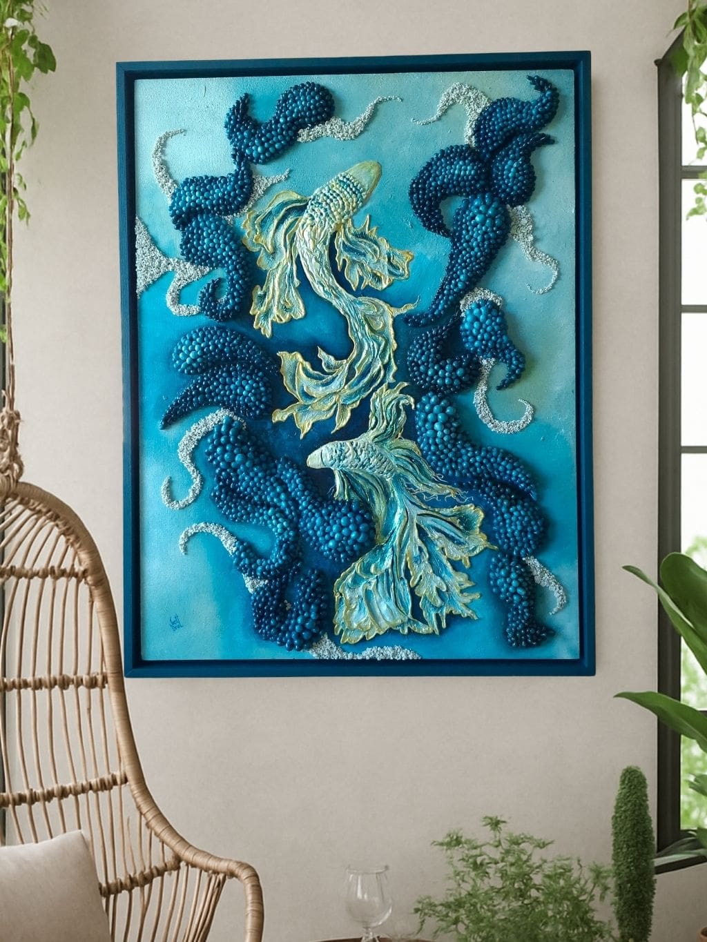 Textured mixed media artwork with hand-sculpted fish shapes in layered blue acrylic tones, surrounded by repeated dark blue sculptural forms, presented in a custom dark blue frame.