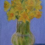 Daffodils in a vase with Blue background