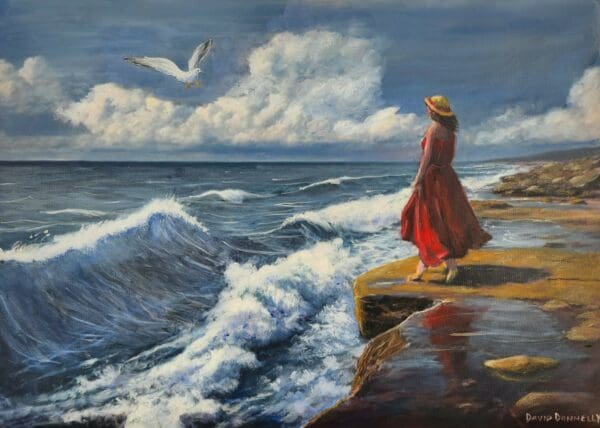 I painted this to explore the pull of the sea and a single figure standing at the edge. The red dress and straw hat ground the scene while the surf and clouds push movement across the canvas. The gull and the wet reflection on the rock add a quiet counterpoint