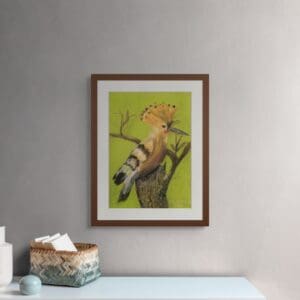 A Painting of a hoopoe sitting on a tree stump hangs on a wall