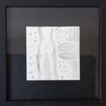 A relaxed monoch summer moment, focusing on the silhouette of a woman.