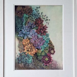 A framed painting of colourful succulents in shades of purple, red, yellow, and green, clustered together on a textured surface with a light background.