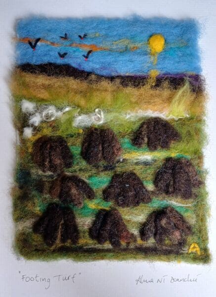 Needle-felted artwork depicting an Irish bog landscape in summer, with turf banks, earthy tones, and soft green vegetation beneath a warm sky.