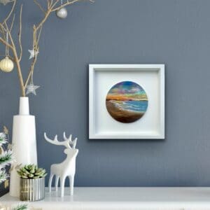Saffron Serenade seascape painting displayed in a cosy room